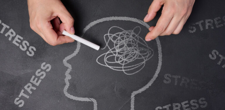 Chalk drawing of a mind being clouded by stress